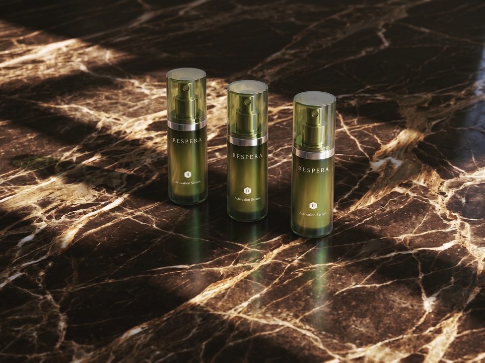 Three olive-green Respera serum bottles on dark veined marble